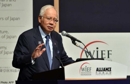 Malaysian Prime Minister Najib Razak delivers an opening speech for the round table meeting of the World Islamic Economic Forum (WIEF) Foundation and Alliance Forum Foundation (AFF) in Tokyo on May 26, 2015. 